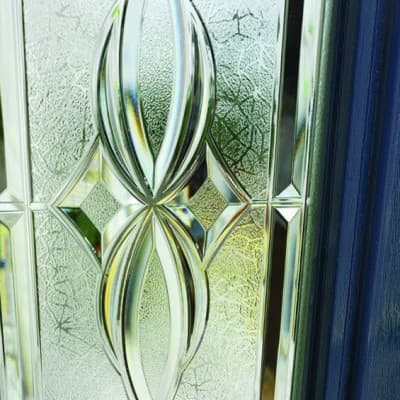 Beveled glass door panel catching the light