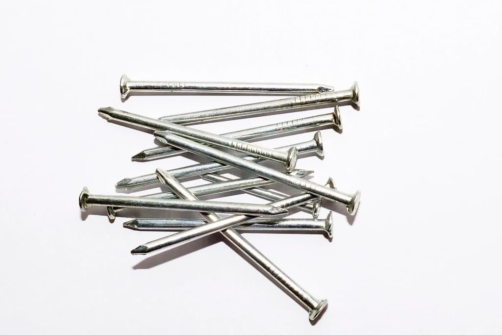 Assorted nails in a hardware bin